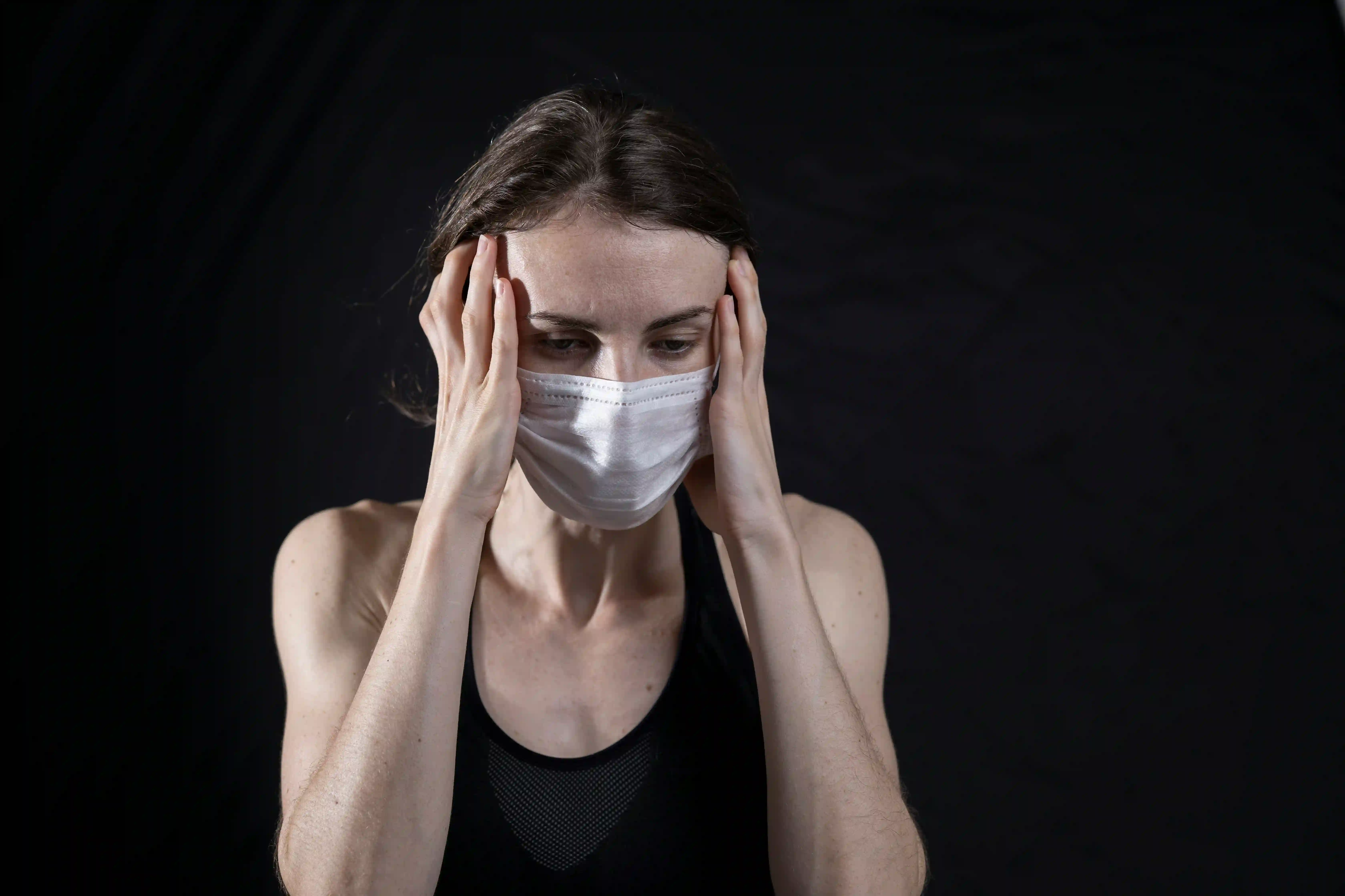 A picture showing a woman with the flu.
